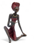Bronze assis à poser 55 cm rouge n°1 Bronzes d'Afrique